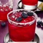 Blueberry Margaritas with a shaker and fresh blueberries.