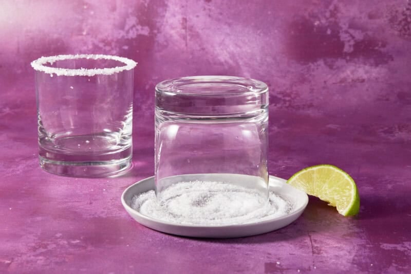 Rimming a glass with salt.