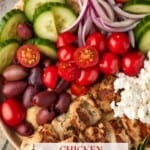 Greek Chicken bowl with feta, pita and hummus.