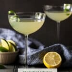 Two Elderflower Martinis on a dark surface.