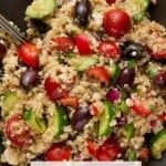 A plate full of Mediterranean Quinoa Salad with a fork for eating.