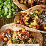 Shrimp Tacos with corn, cilnatro and cotija cheese.