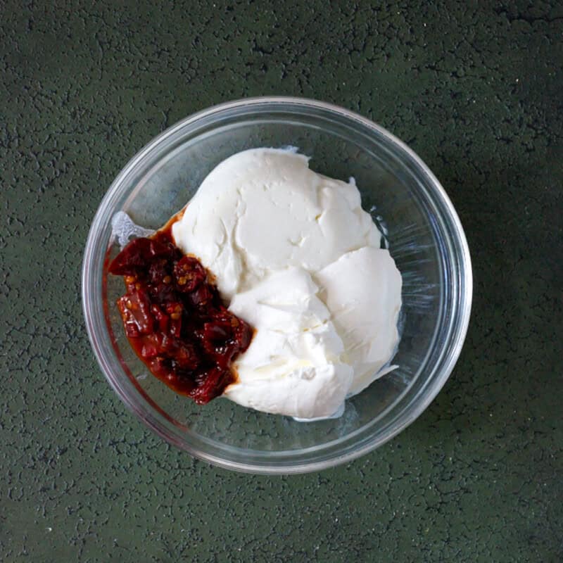sour cream, greek yogurt and chipotle peppers in bowl