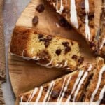 A slice of Sour Cream Chocolate Chip Coffee Cake propped on its side with other slices around it.