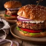 Turkey burgers on sesame buns with red onion.