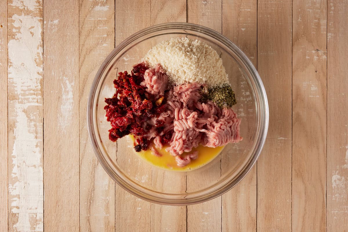 Ground turkey in bowl with seasonings and panko.