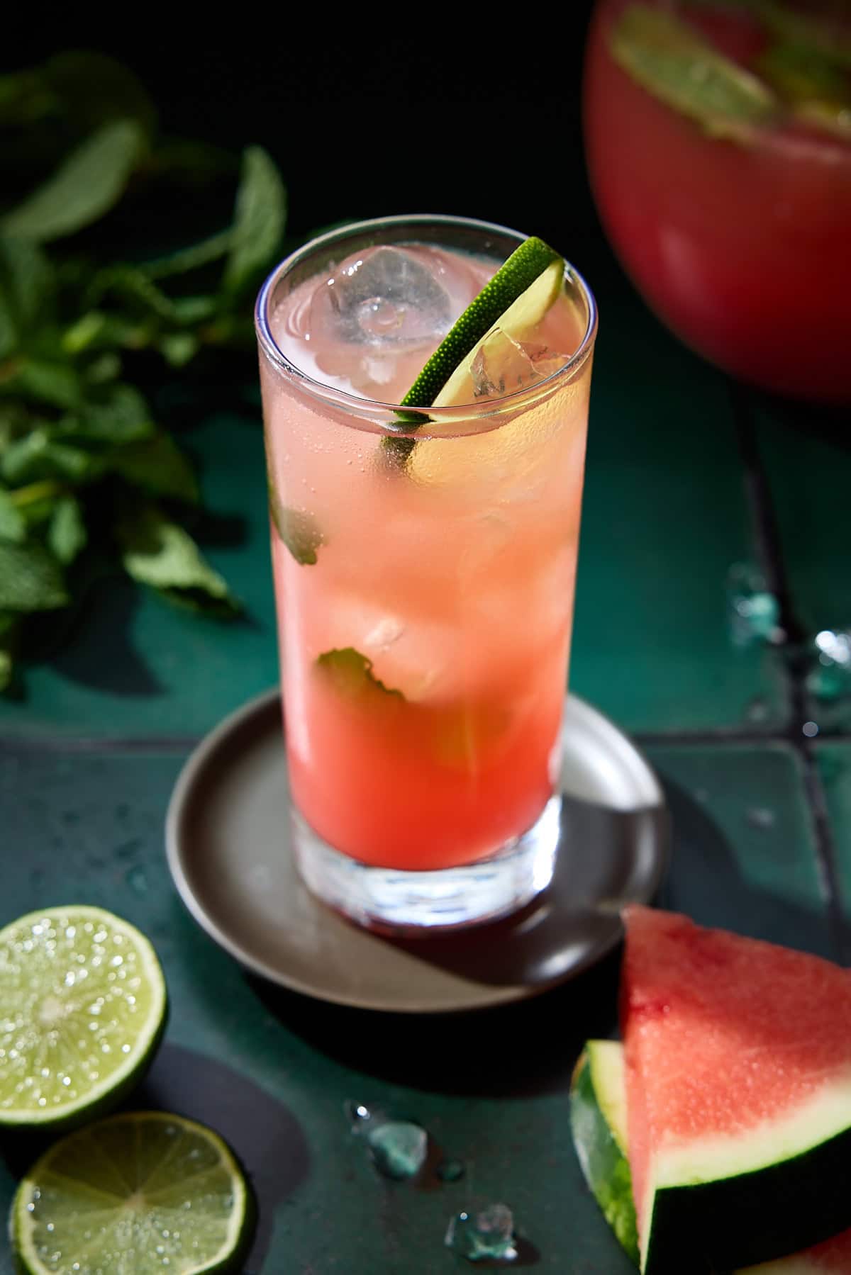 Watermelon mojito in a highball glass with mint and lime.