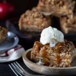 Apple Crisp bar topped with a scoop of vanilla ice cream and drizzled with caramel sauce.