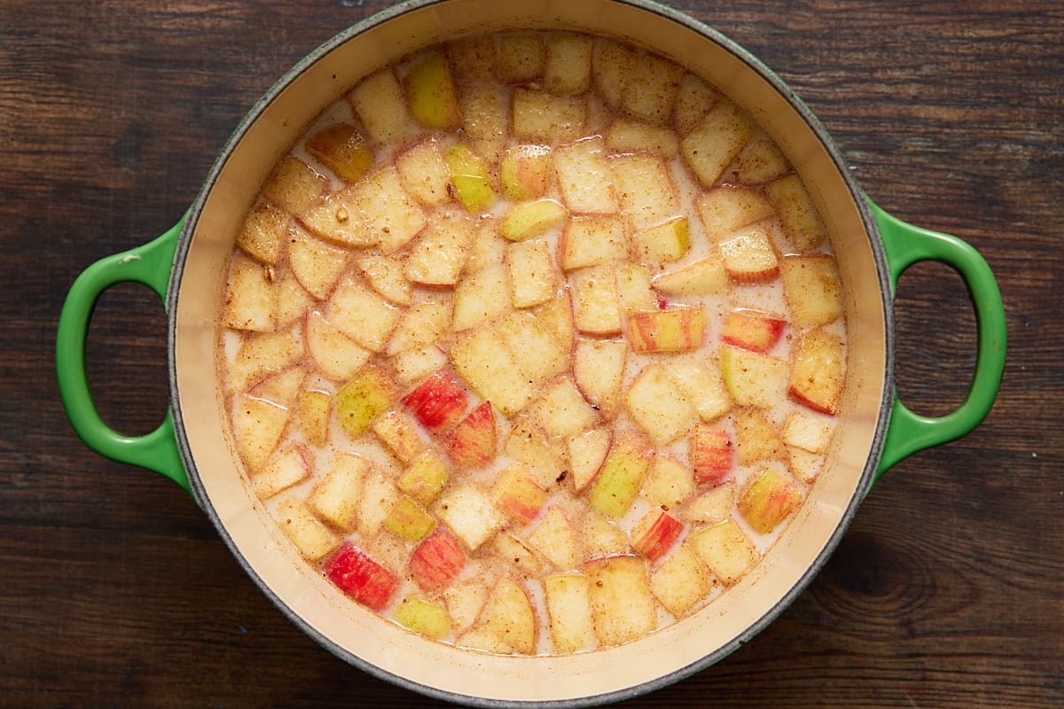 Apples and milk in a dutch oven.