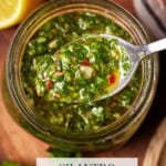 chichurri in a glass jar with a spoon for serving.