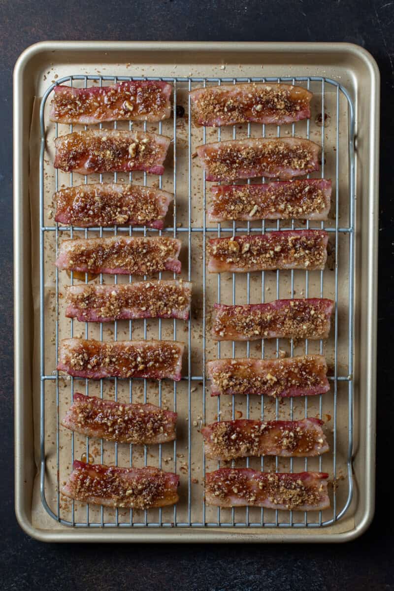 Full sheet pan of brown sugar topping on par cooked bacon.